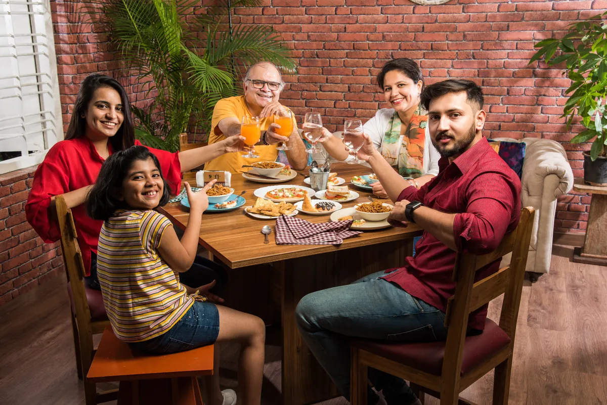 Multigenerational family sharing dinner together