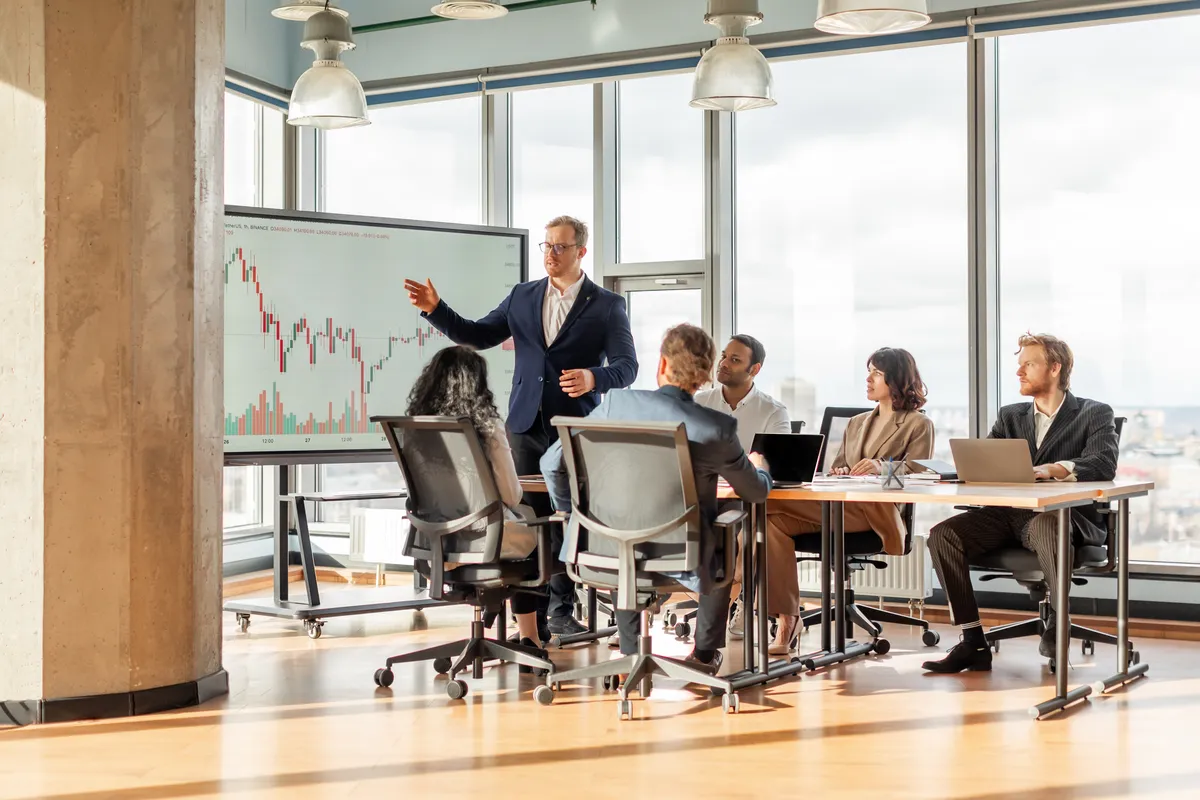 Investors and founders in a bright office meeting